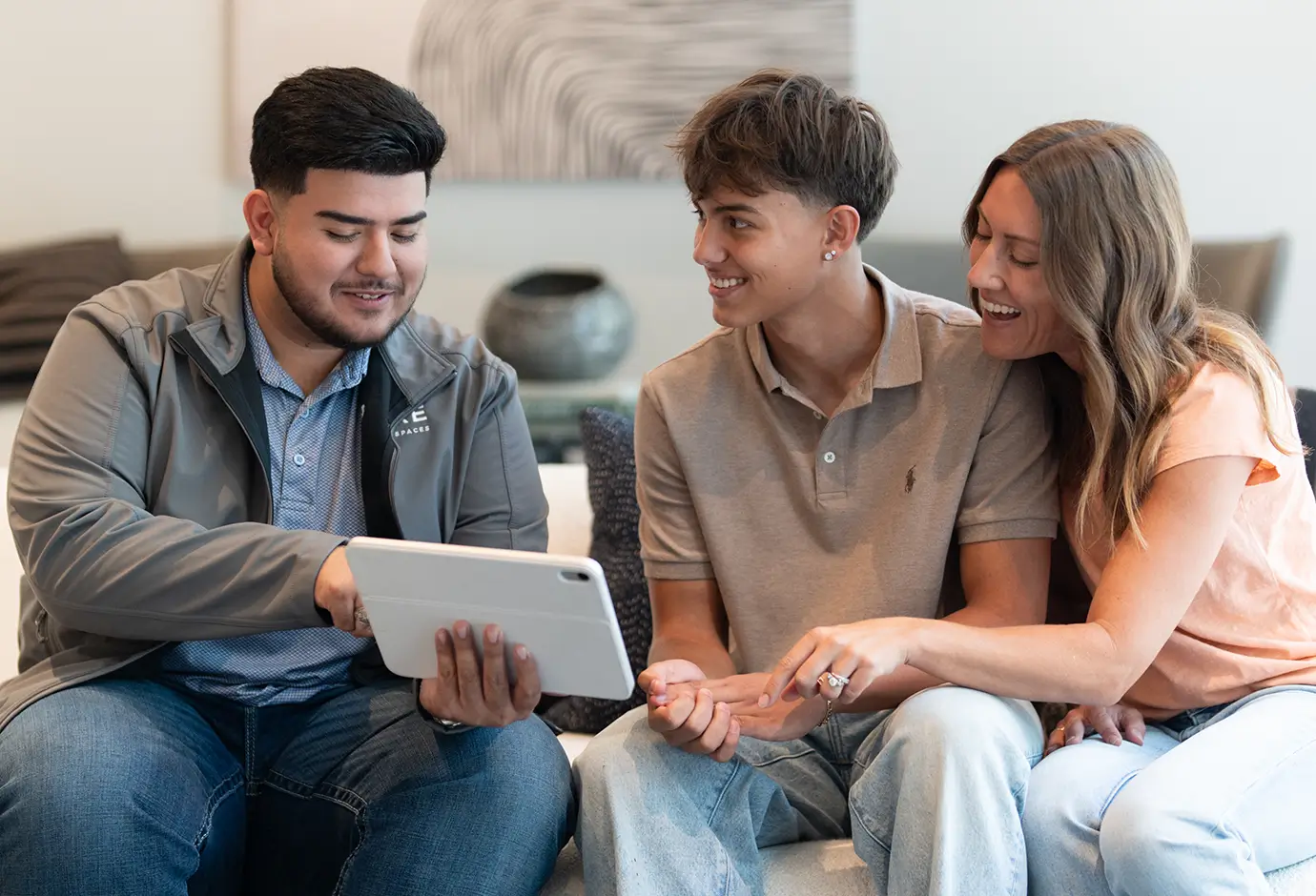 a family reviewing information on a tablet